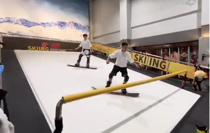 Snowboarder on ski treadmill